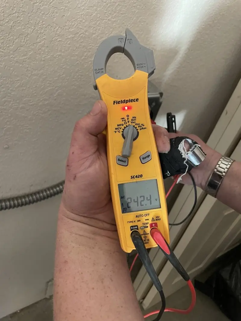 Voltage testing with clamp meter during Whole House Surge Protector in Fort Bliss